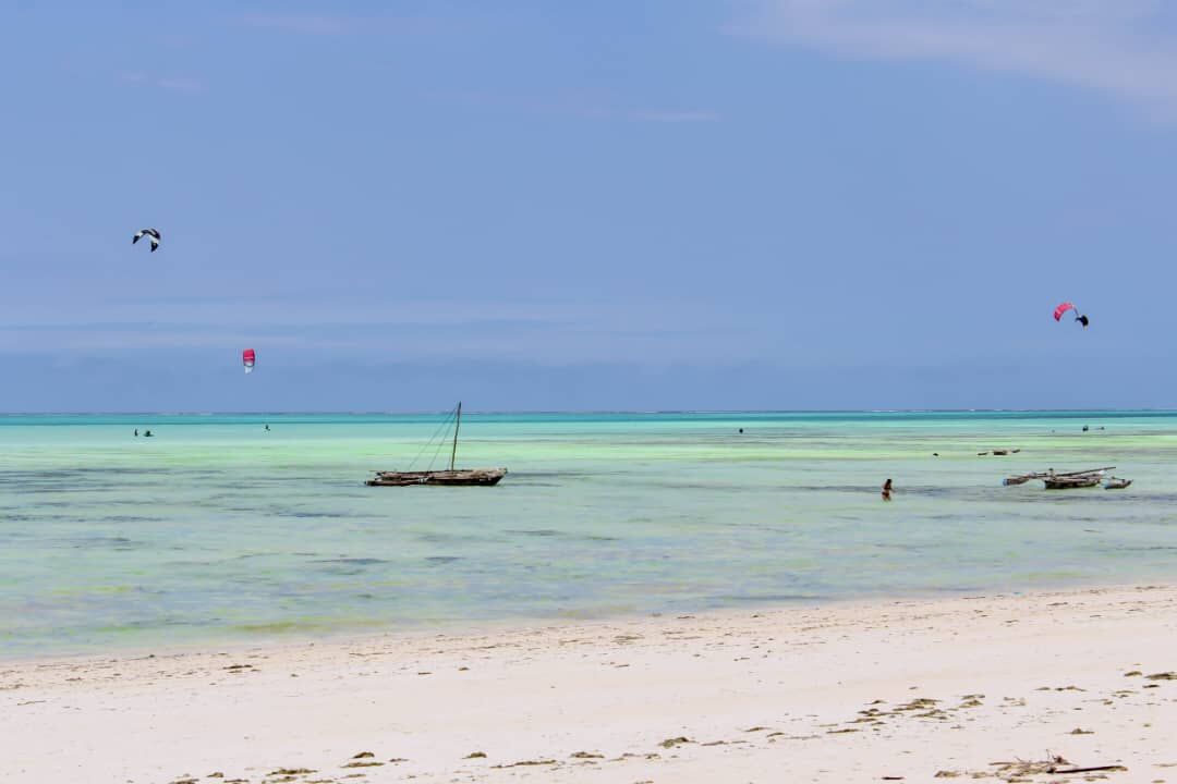 Kitesurfers over the turquoise lagoon